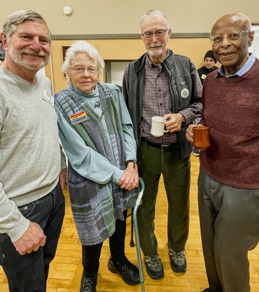 four old friends sharing coffee hour in Channing Hall