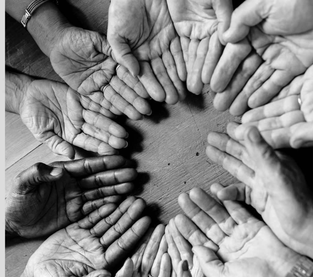 flower circle made up of hands face up 