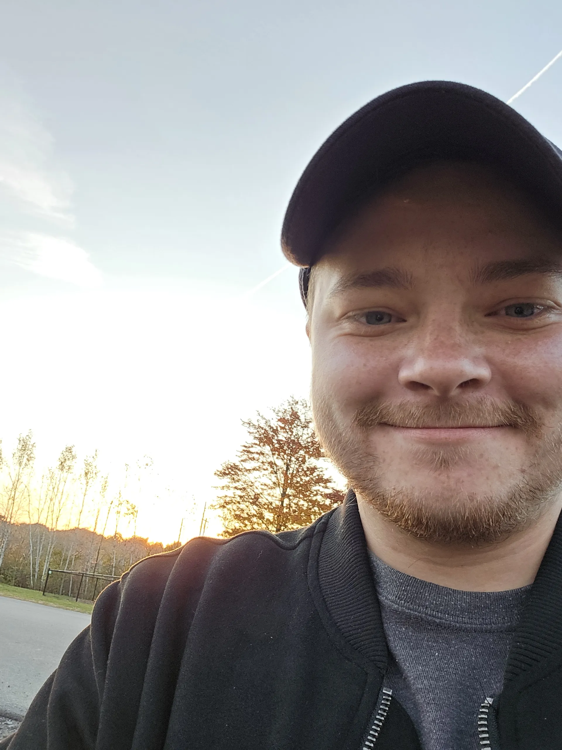 Portrait of Adrian Cattell smiling outdoors