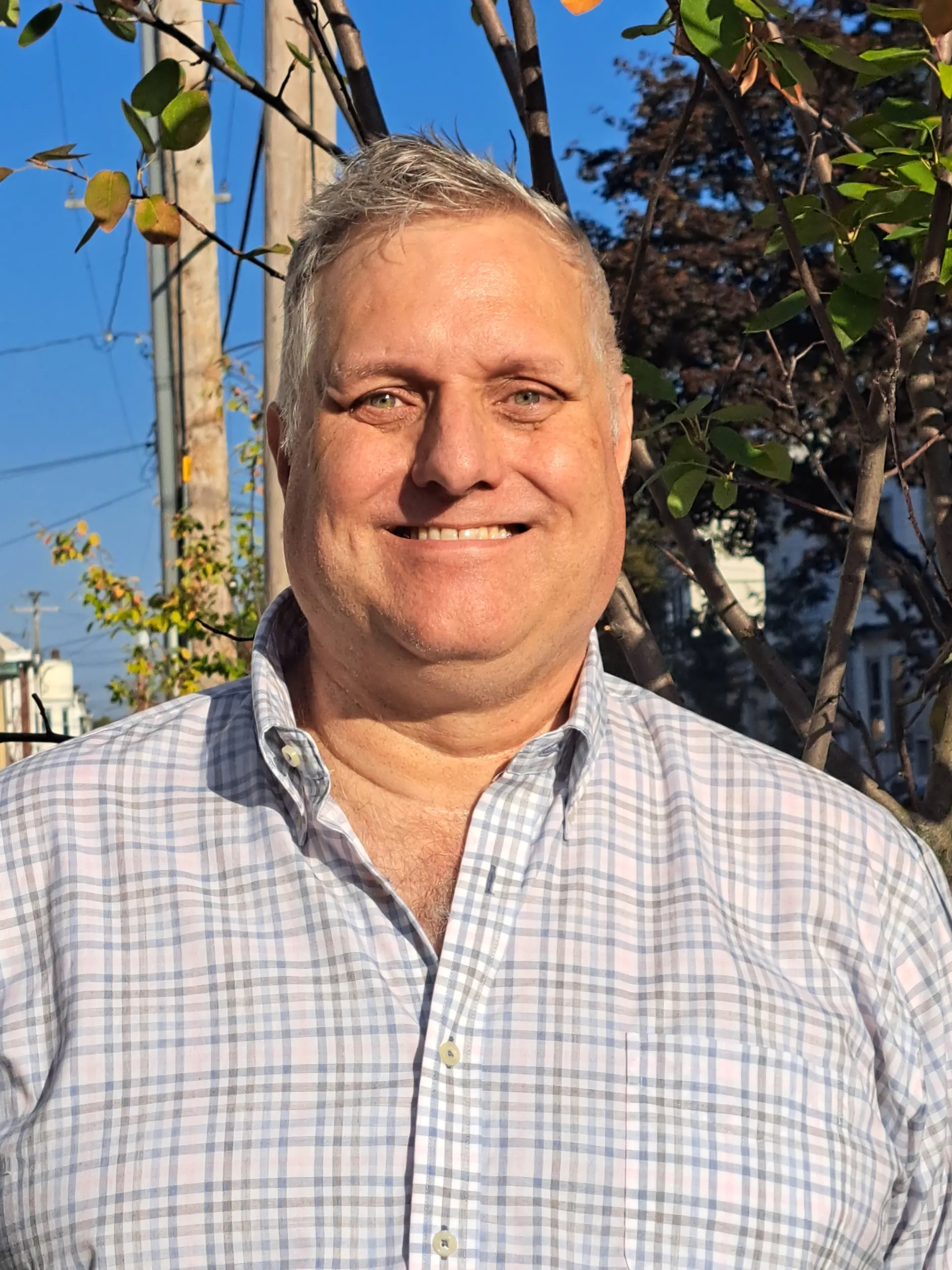Portrait of Erik Vonhausen smiling outdoors