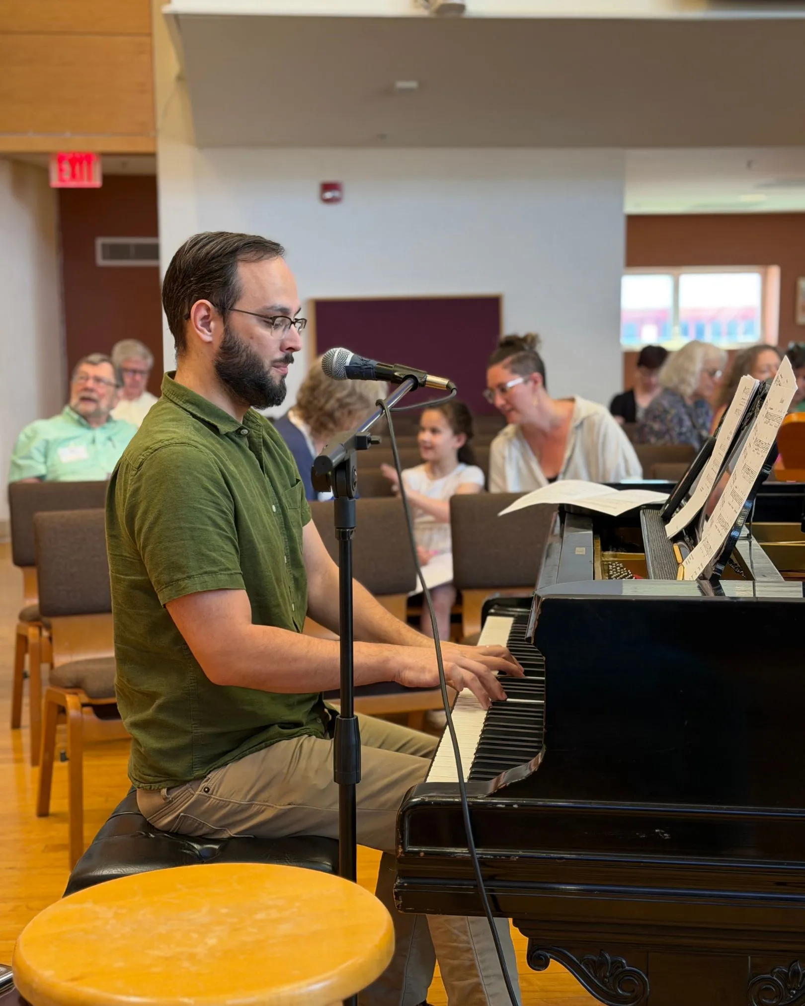 A pianist and vocalist performing together during a music ministry collaboration
