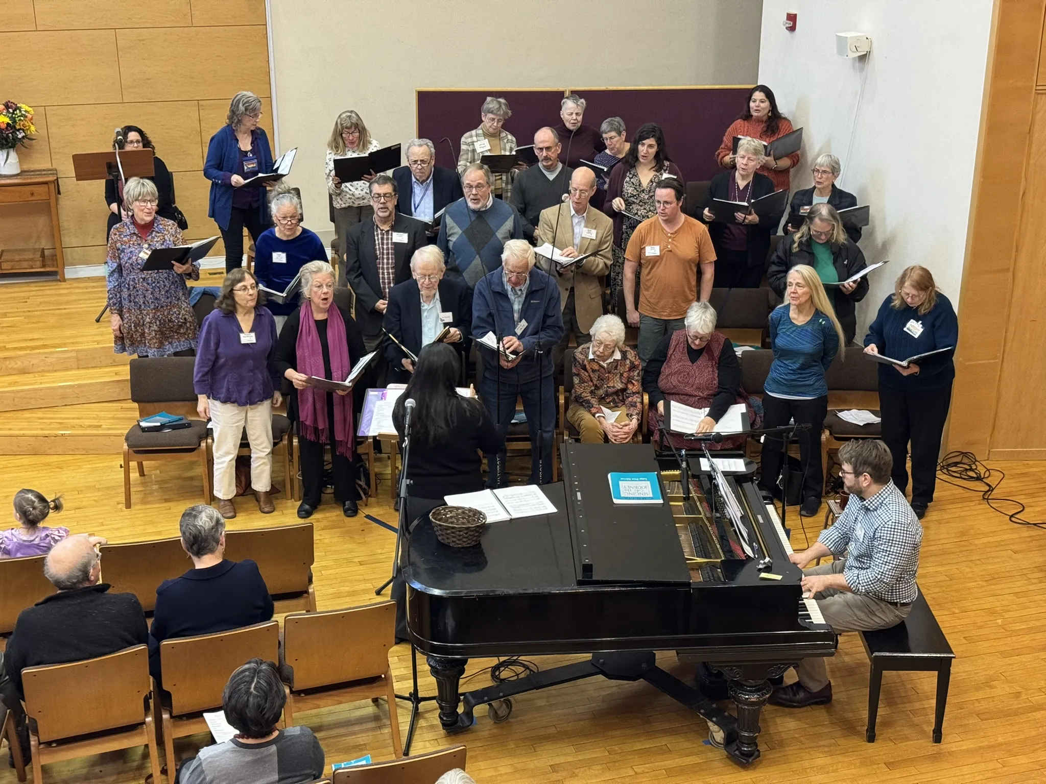 A choir and pianist performing together in the sanctuary