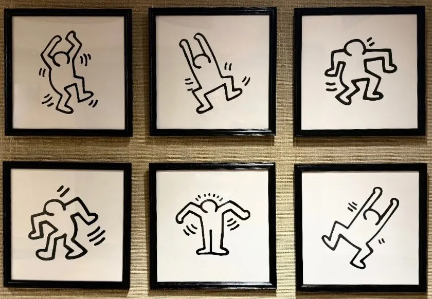 A framed series of six Keith Haring-style dancing figure prints