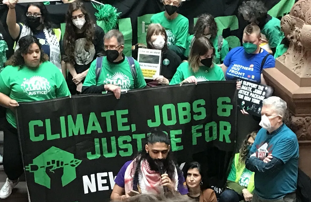 A large group posing together at a 2024 NY Renews rally