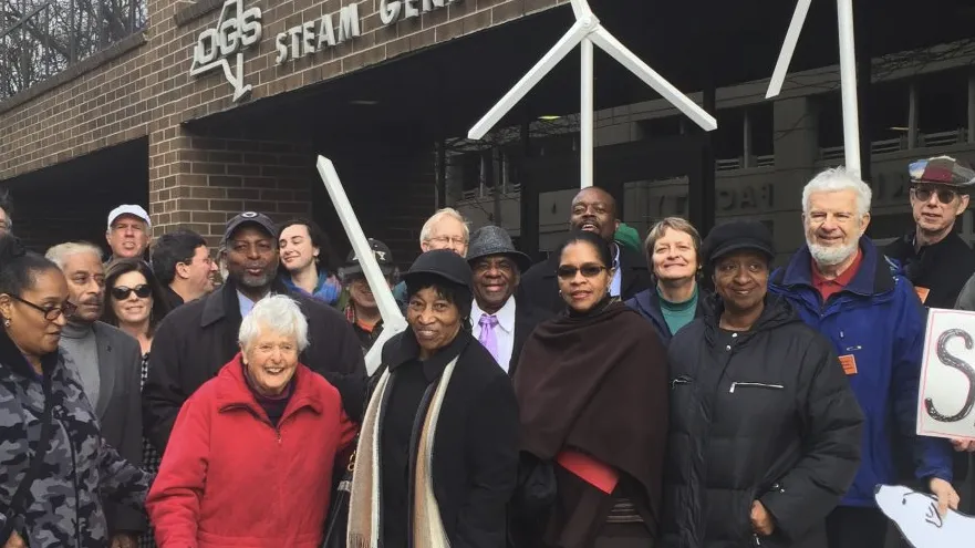 A group posing together outside a building during an advocacy event
